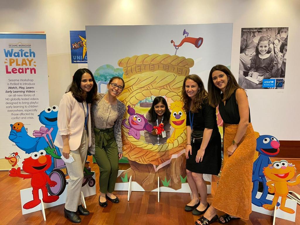 Amy with her friends with props from the Sesame workshop.